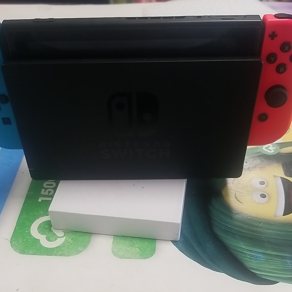 Nintendo Console with Blue and Red Controllers